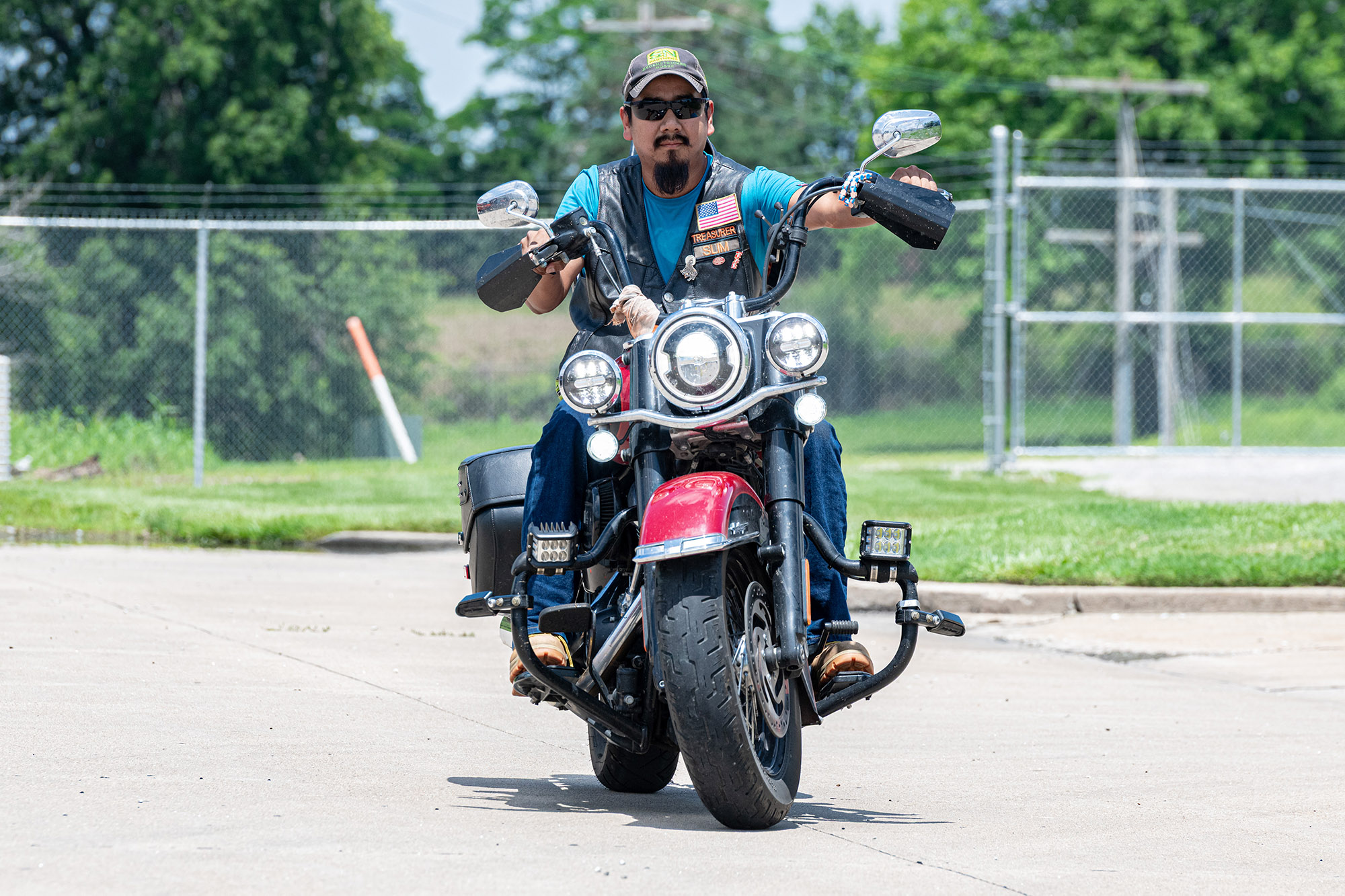 Person riding red motorcycle